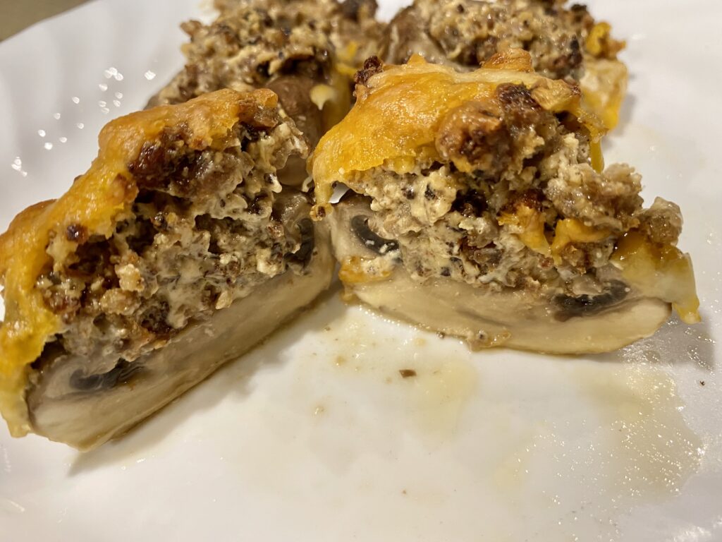 Stuffed Mushrooms with Sausage and Cream Cheese Cut in Half