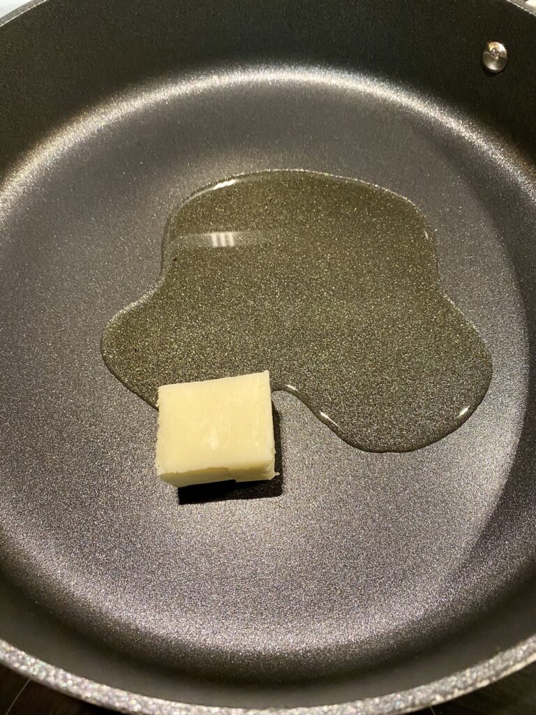 Combine butter and oil in a large skillet.  